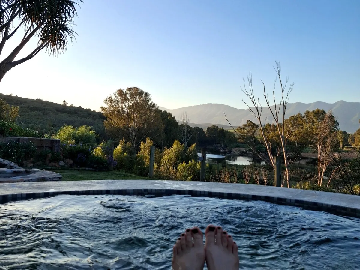 Riverhide jacuzzi overlooking the Breede River Valley landscape